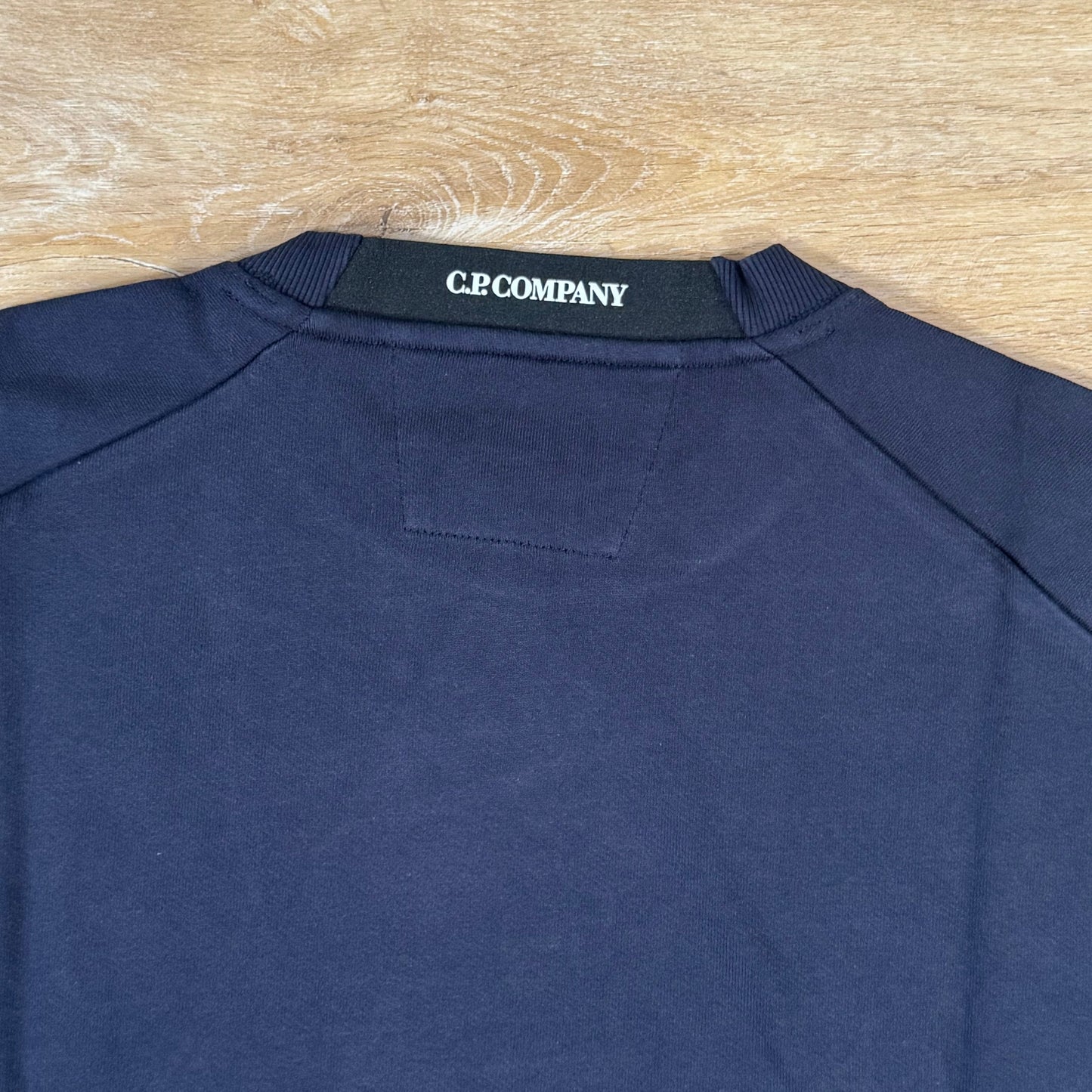C.P. Company Diagonal Raised Fleece Crewneck Lens Sweatshirt in Navy