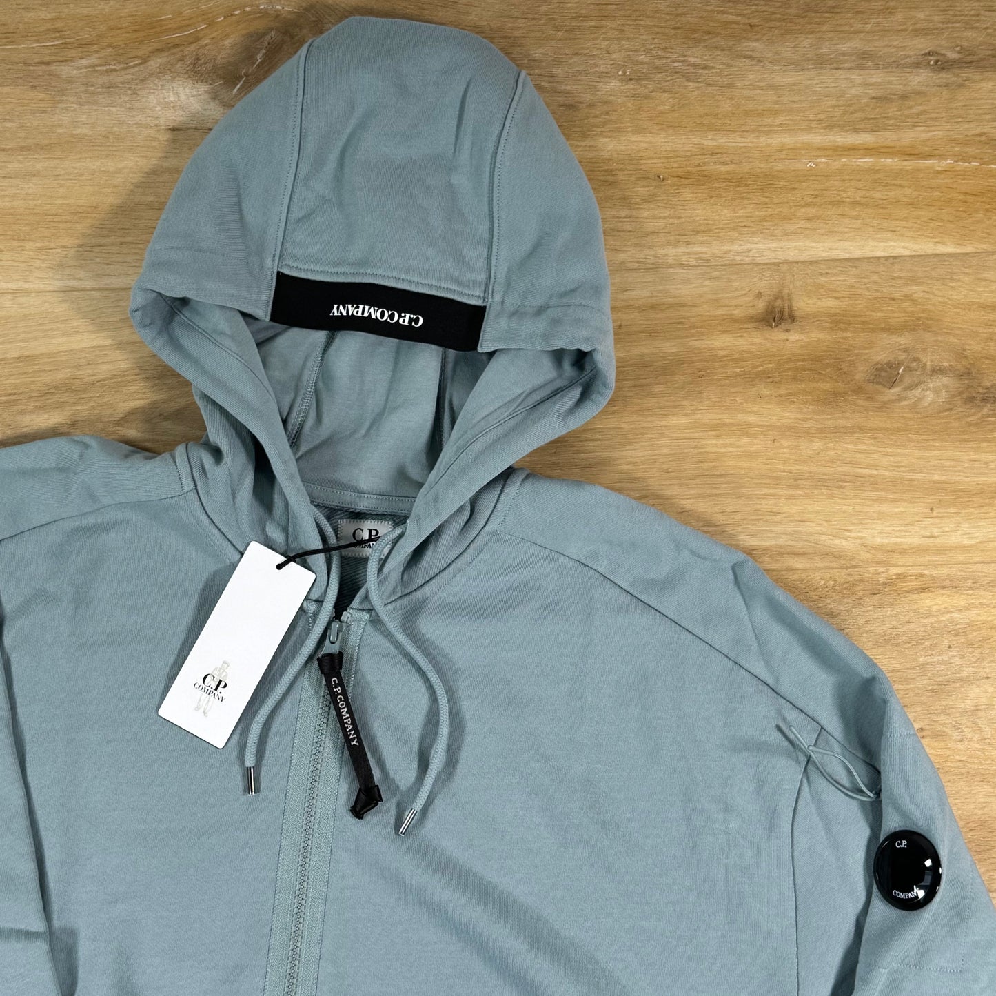 C.P. Company Diagonal Raised Zipped Lens Hoodie in Silver Blue
