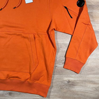 C.P. Company Diagonal Raised Fleece Lens Hoodie in Russet Orange